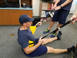 Firefighters demonstrating harness usage