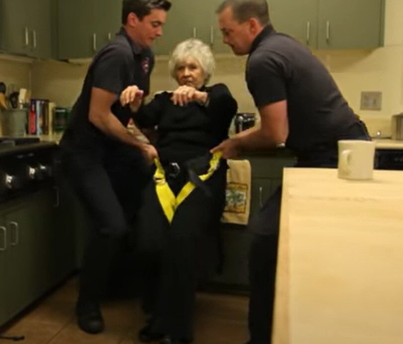 emts-helping-woman-up